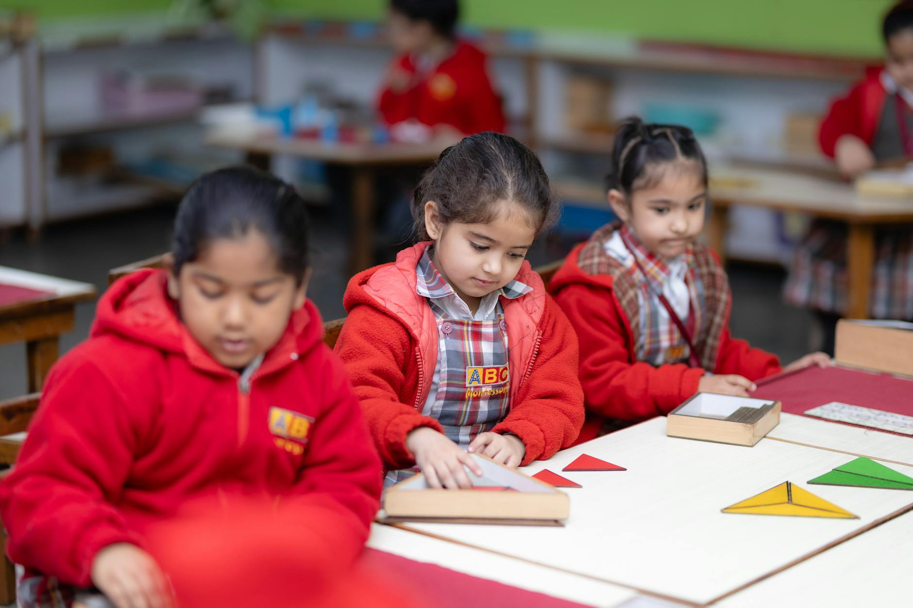 Young children engaged in learning in a Montessori childcare classroom