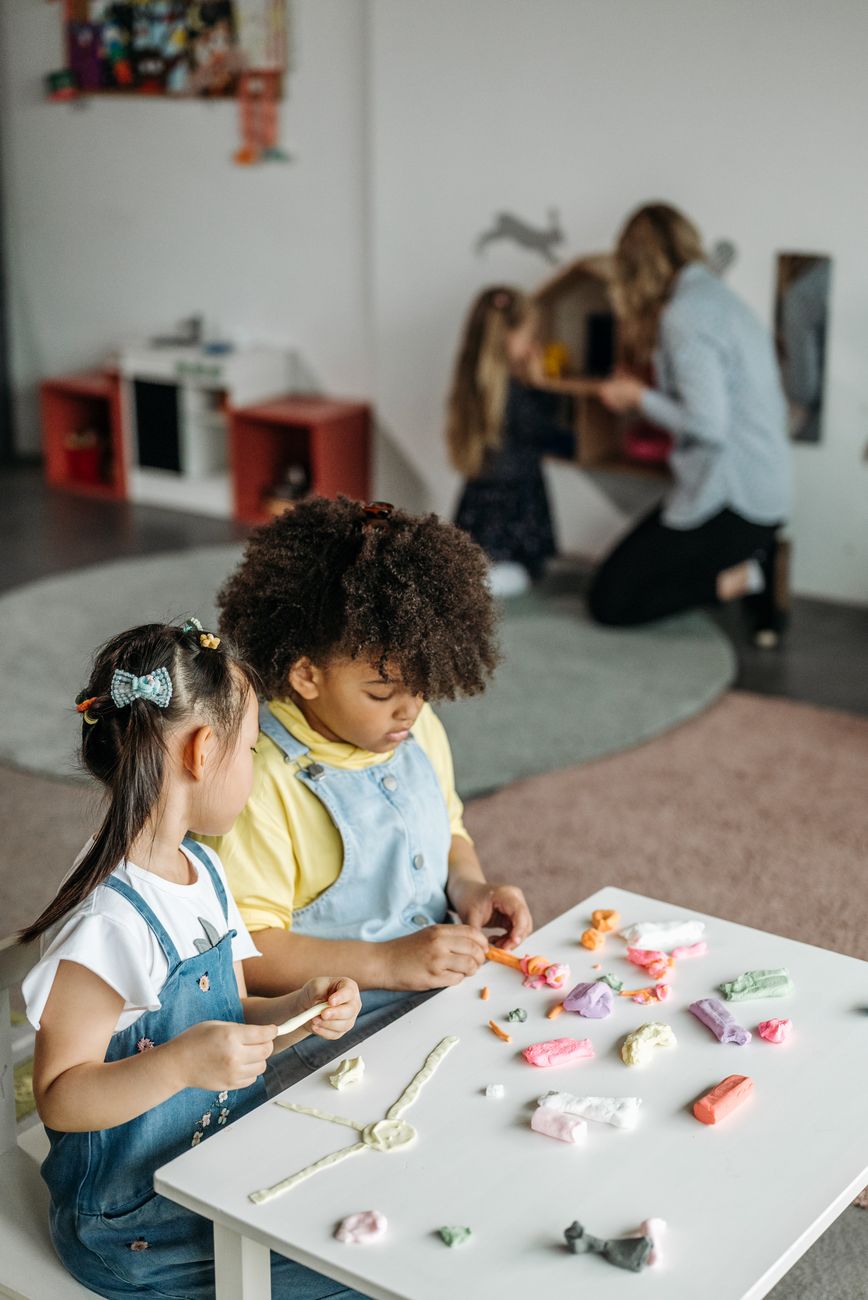 Kids engaging in play and creativity in a kindergarten classroom.